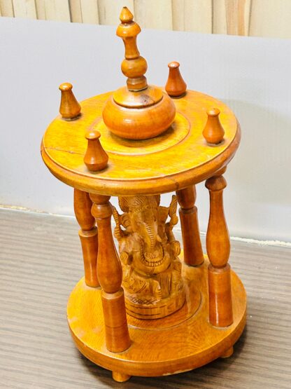 Elegant Wooden Ganesha Shrine with Decorative Pillars